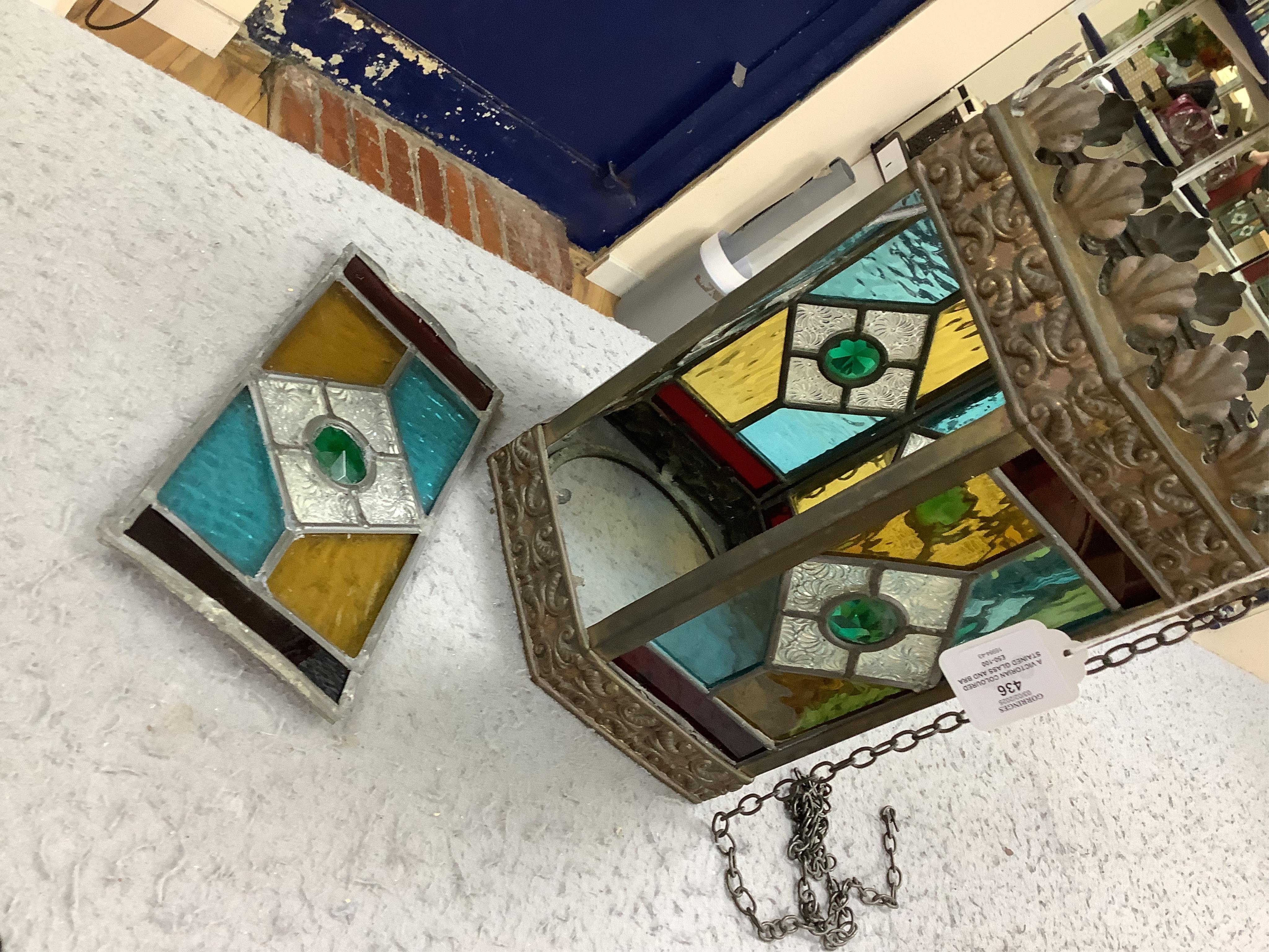 A Victorian coloured stained glass and brass six sided lantern, 31cm high x width 22cm. Condition - glass good, one clip on frame for glass missing